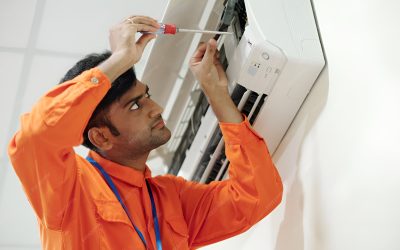 concentrated-young-indian-engineer-orange-wear-using-screwdriver-while-setting-up-air-conditioner_274689-26390(1)